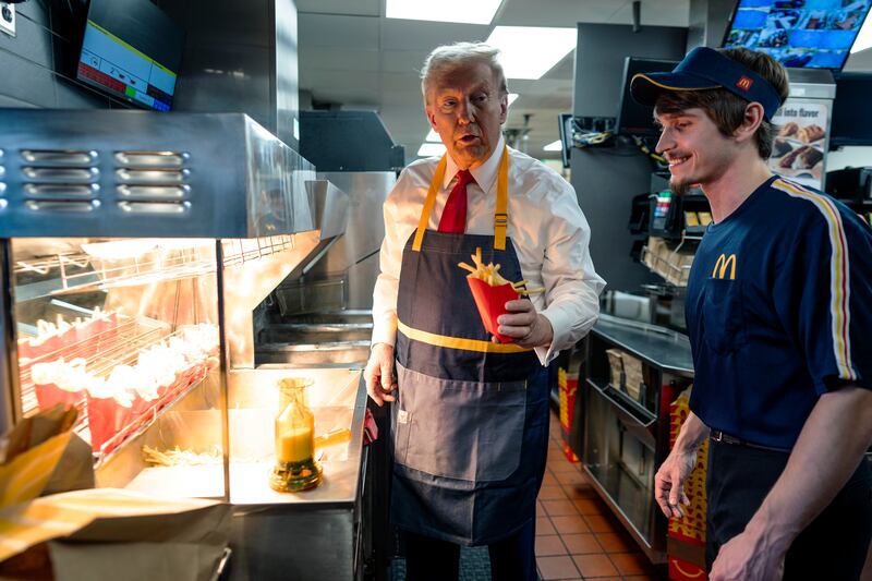 President-elect Donald Trump works behind the counter during a campaign event at McDonald's restaurant on October 20, 2024 in Feasterville-Trevose, Pennsylvania.